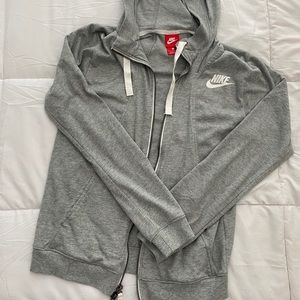 Light grey women’s Nike zip up. NEVER WORN.